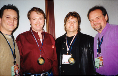 Larry Weir along with his co-editor for New Music Weekly Paul Loggins (left to right) & country artists Phil Calkins & Rick Hertess at the 2002 CRS Convention in Nashville, TN.