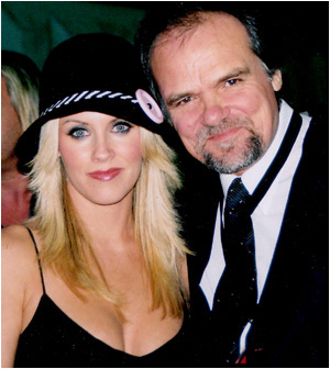 Playboy queen Jenny McCarthy joins Larry at an industry event.