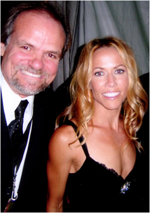 Larry with recording artist Sheryl Crow. Looks like they found that stalker!